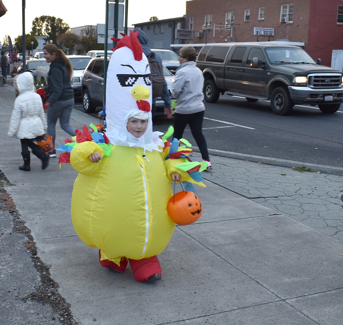 Teddy Frei, 5, makes a run for the candy at Ephrata’s downtown trick-or-treat event Thursday.