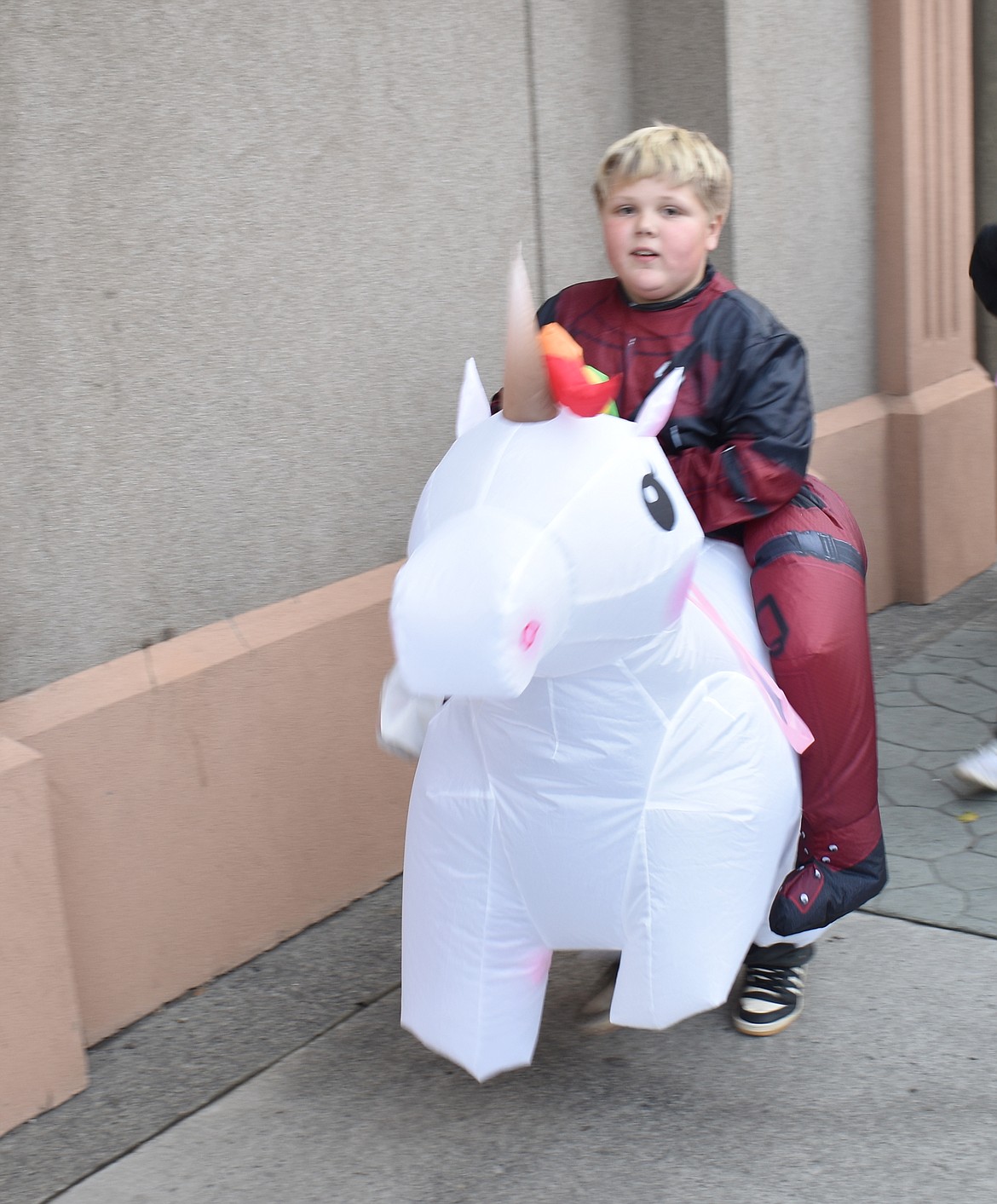 Ender Rippet, 9, is Deadpool astride his unicorn at Ephrata’s downtown trick-or-treat event Thursday.