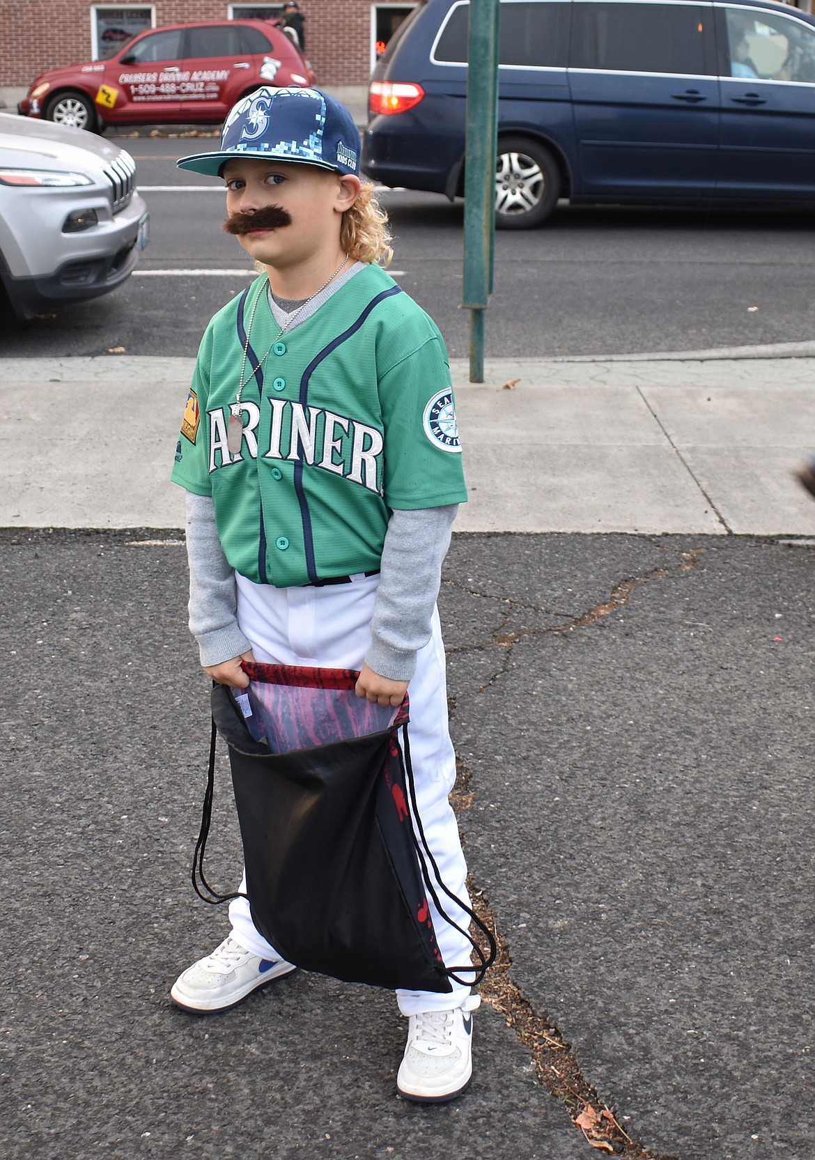 Seven-year-old Cal Chamberlin is the Big Unit himself, Mariners legend Randy Johnson for Ephrata’s downtown trick-or-treat event Thursday.