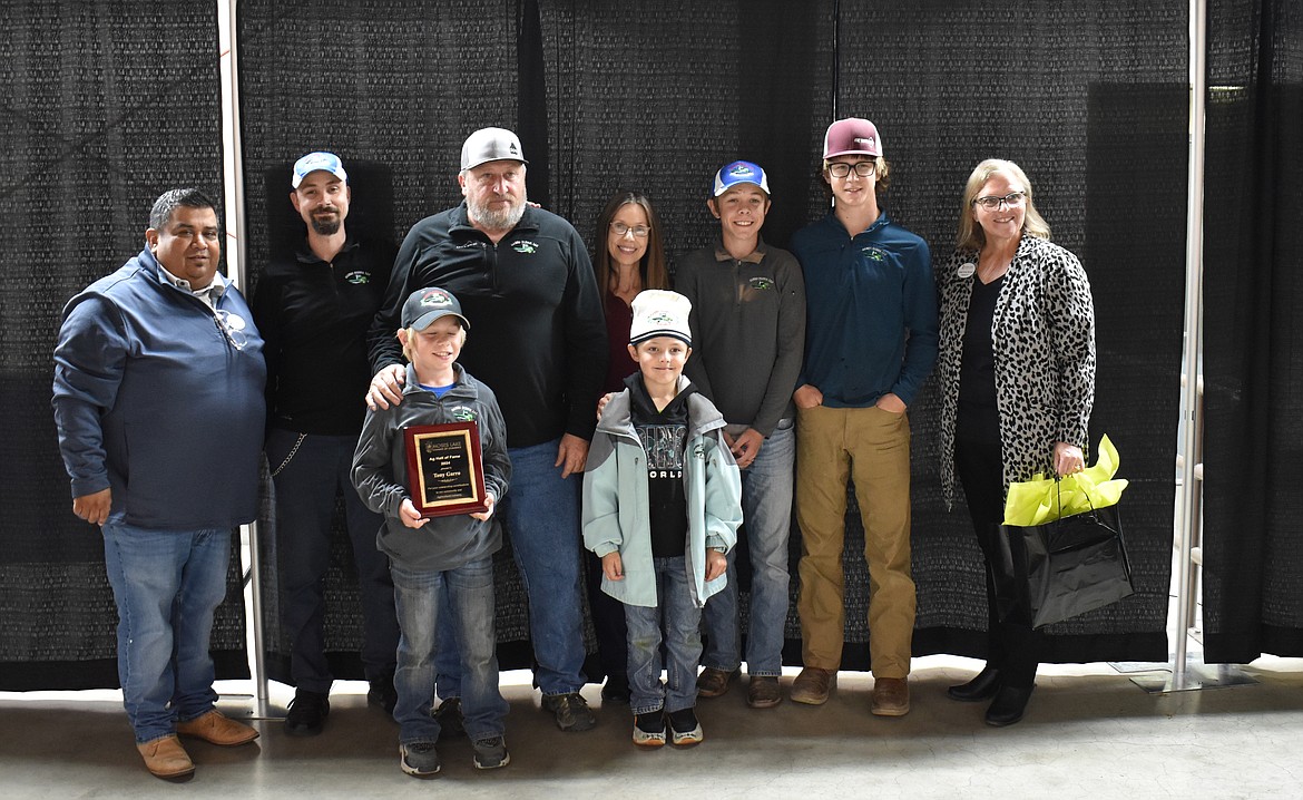 Moses Lake farmer Tony Garro, third from left, was honored Oct. 15 as a member of the Moses Lake Agriculture Hall of Fame. Surrounding Garro are his famikly and Moses Lake Chamber of Commerce Board Chair Jason Avila, far left Chamber President and CEO Debbie Doran-Martinez, far right.