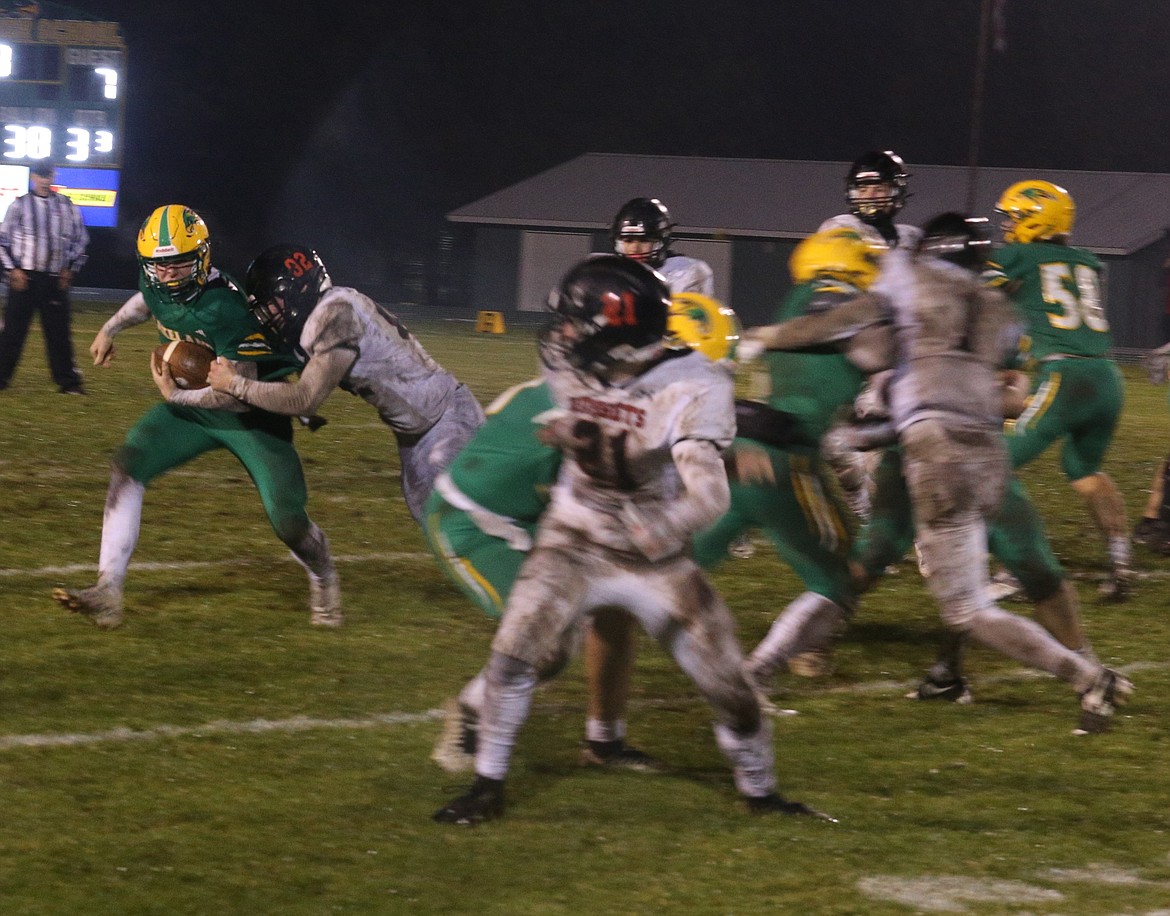 JASON ELLIOTT/Press
Lakeland junior quarterback Haydon Benson attempts to get to the corner to turn upfield during the third quarter of Friday's state 5A football playoffs against Shelley at Corbit Field in Rathdrum.