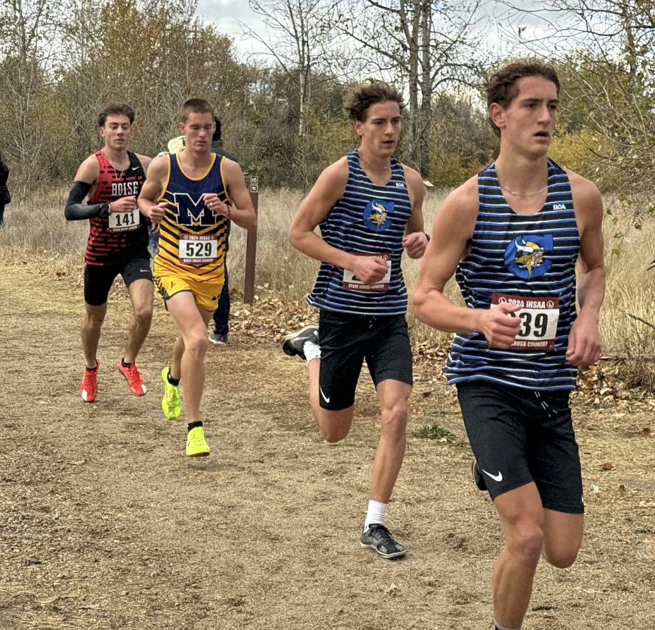 Courtesy photo
Coeur d'Alene High seniors Max Cervi-Skinner (front) and Zack Cervi-Skinner maintain a lead on the rest of the 6A boys pack in the state cross country meet at Eagle Island State Park on Saturday.