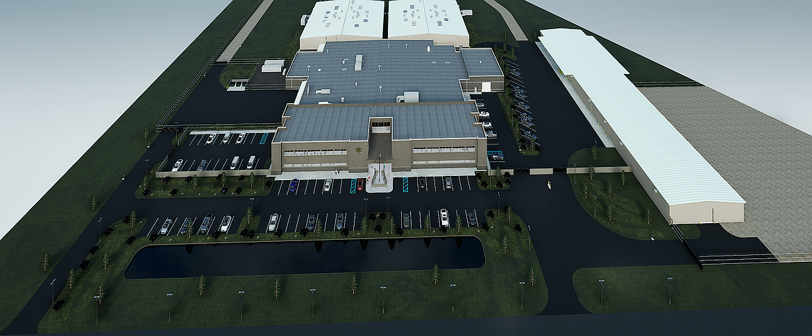 An aerial view of the Grant County Criminal Justice Center concept art. A vehicle maintenance facility is off to the right. The administrative offices are the brown-gray building toward the front. The two white-roofed wings to the rear are the two jail buildings that will house prisoners.