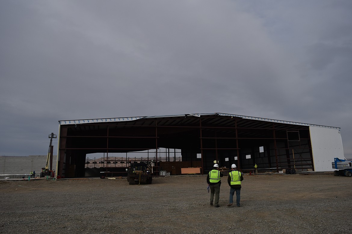 Grant County Sheriff Joey Kriete explains to Columbia Basin Herald Managing Editor R. Hans “Rob” Miller how the inside of the jail buildings while crews continue the process of constructing the building closest to State Route 17.