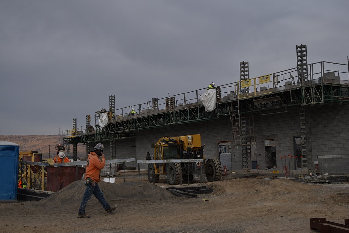 Crews continue working on the walls for the administration building at the new justice center in Ephrata.