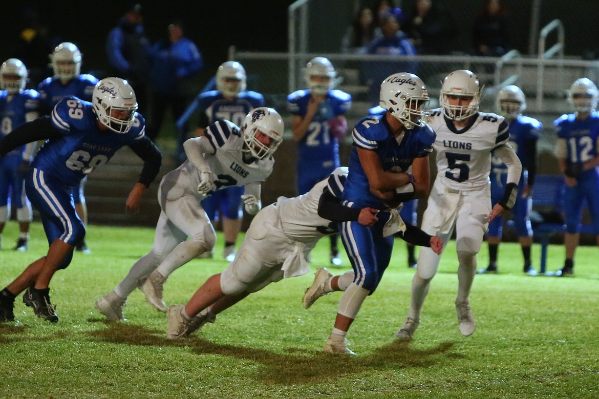 Eagles senior Jairo Lopez (2) runs with the football in the first quarter against MLCA/CCS. Head Coach Garrett Devine said Lopez’s ability to run with the football opened up Soap Lake’s offense Friday night.