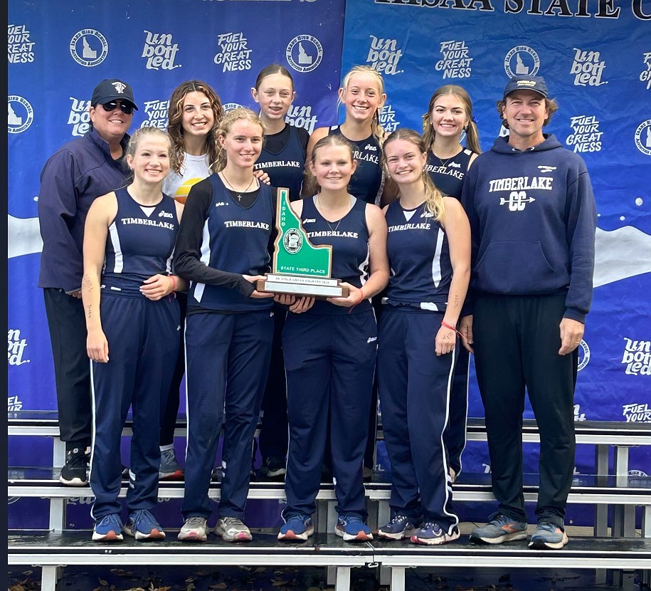 Courtesy photo
The Timberlake High girls cross country team finished third in the state 4A meet on Saturday at Eagle Island State Park. In the front row, from left are Emily Wright, Vanessa McLachlan, Aubrey Jenson and Malia Miller. In the back are assistant coach Jennifer Hammond, Addisen Berg, Kayla Hyle, Lola Eggleston, Jozee MacArthur and head coach Shawn Lawler.