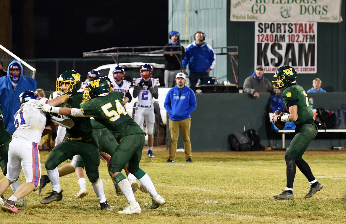 Carson Gulick, right, has hands on the ball at the football game v. Bigfork on Nov. 1. (Kelsey Evans/Whitefish Pilot)