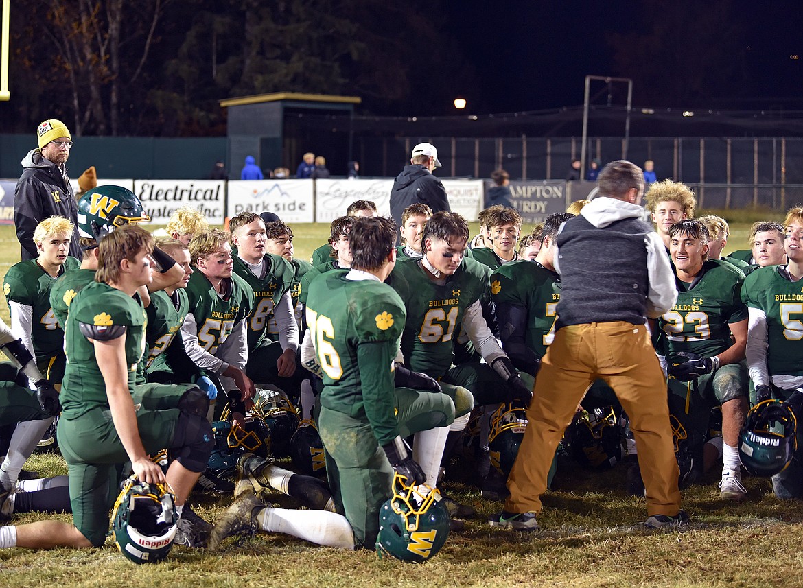 Head Coach Brett Bollweg gathered with the team at the end of the game against Bigfork on Nov. 1. (Kelsey Evans/Whitefish Pilot)