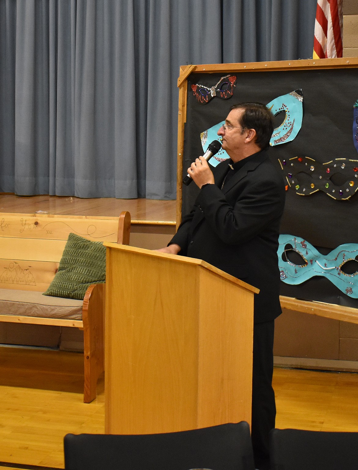 Bishop Joseph Tyson of Yakima welcomes attendees to the St. Rose of Lima Catholic School auction Saturday. Tyson, who was born in Moses Lake, shepherds a diocese that comprises Benton, Chelan, Douglas, Grant, Kittitas, Klickitat and Yakima counties.