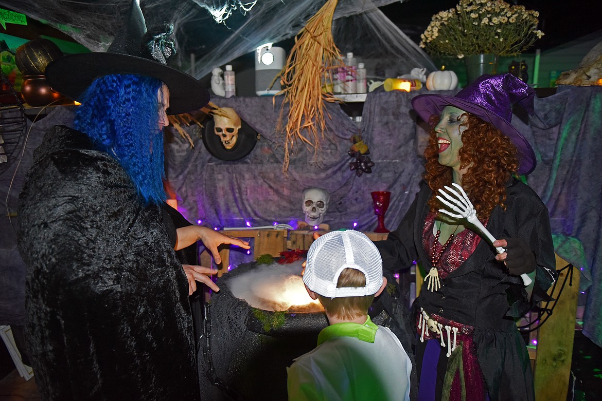 Witches brew up cauldrons of candy at Stumptown Art Studio's Hallowen haunted house. (Kelsey Evans/Whitefish Pilot)