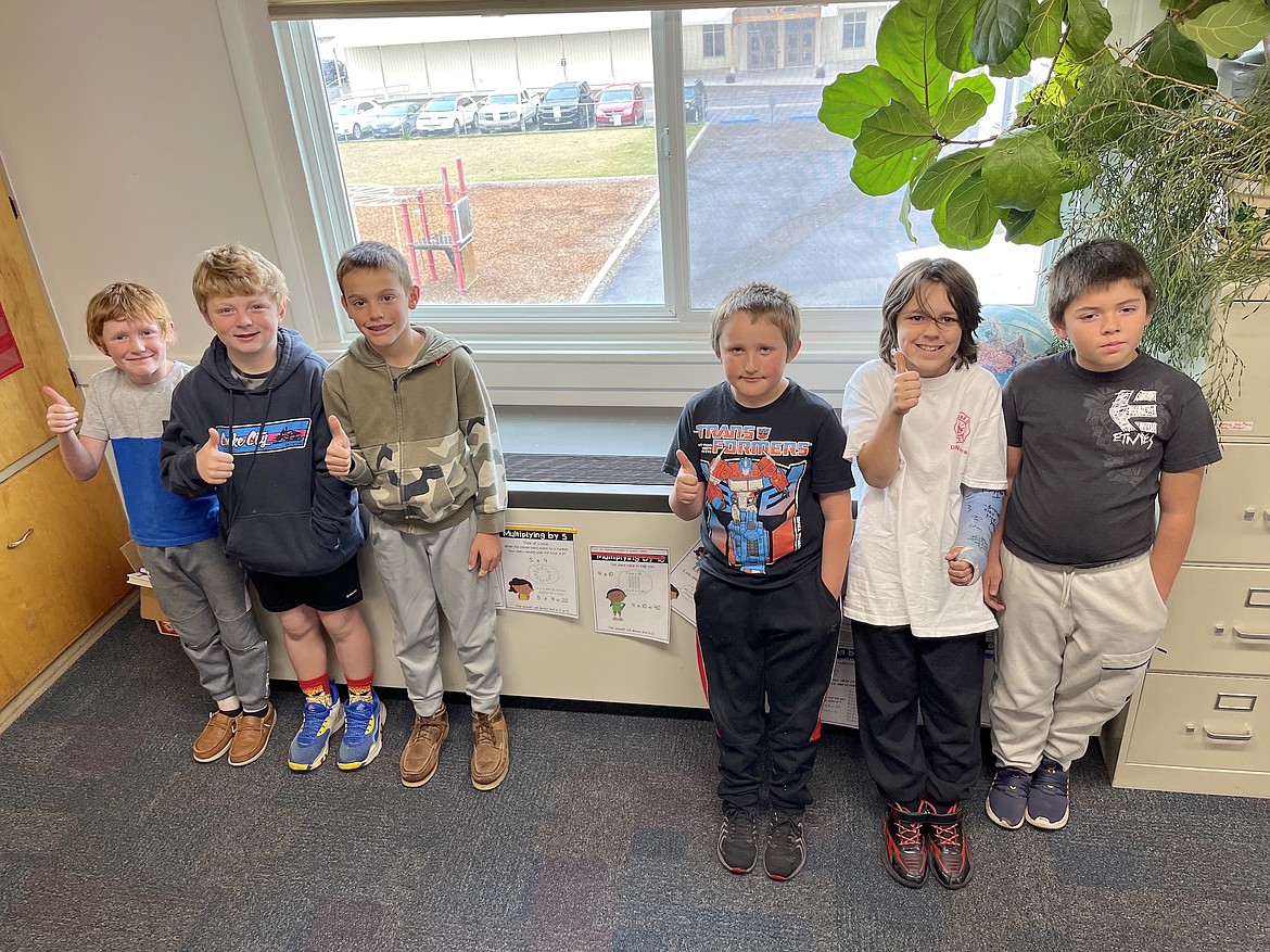 Charlo's six third graders – Cooper Shrider, Jaxon Fuhrmann, Cash Cole, Jaxton DuMont, Nathan Porter and Andrew Lopez – give their new heating/cooling unit at Charlo Elementary a big thumbs up last November. (Kristi Niemeyer/Leader)