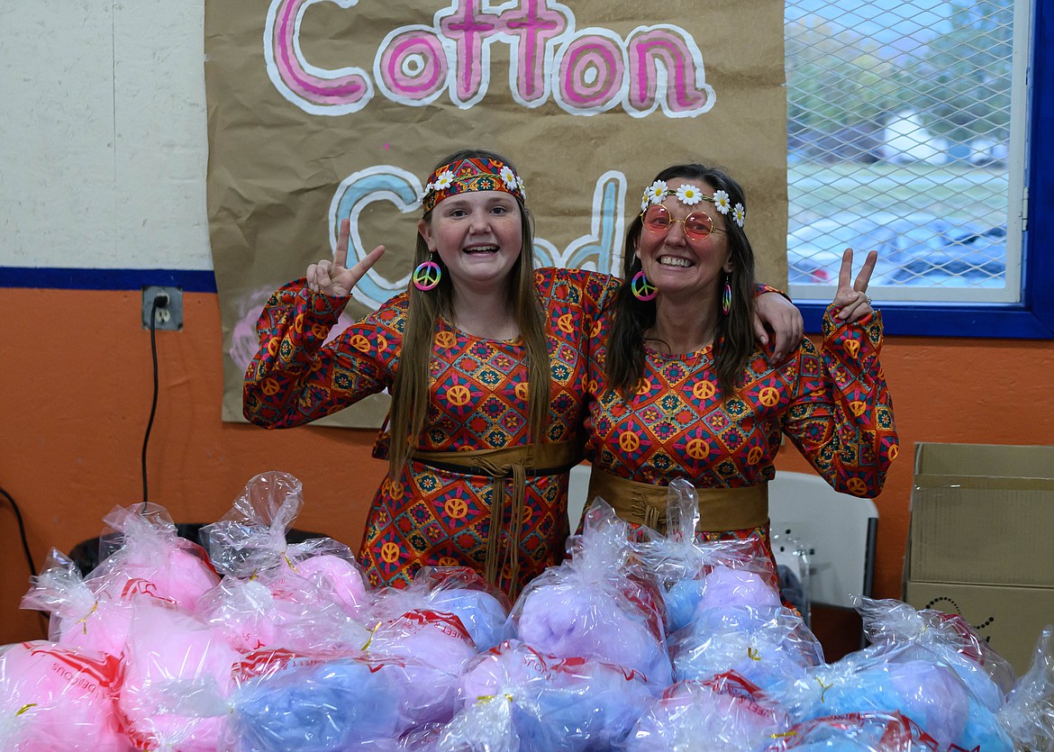 Mom and daughter Kari and Kyla Bauer at the cotton candy booth at Plains Alliance Church. (Tracy Scott/Valley Press)