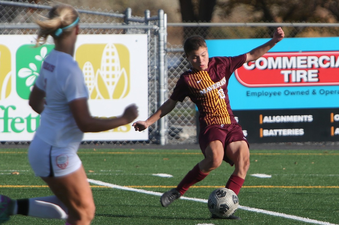 Moses Lake senior Sam Escamilla, right, attempts a shot late in the second half against Eastmont on Saturday. Escamilla scored on a follow-up attempt soon after.