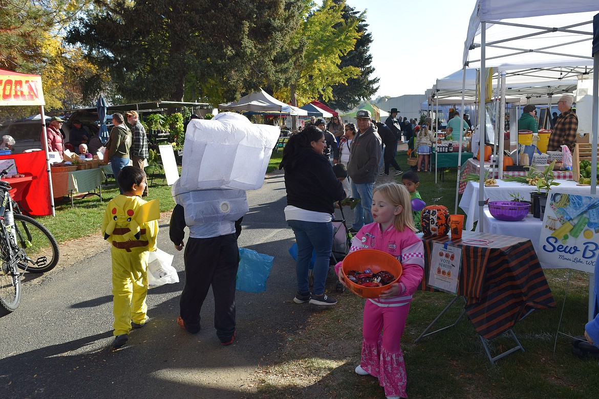 Children dressed in costumes were able to trick-or-treat the various stands at the Moses Lake Farmers Market.