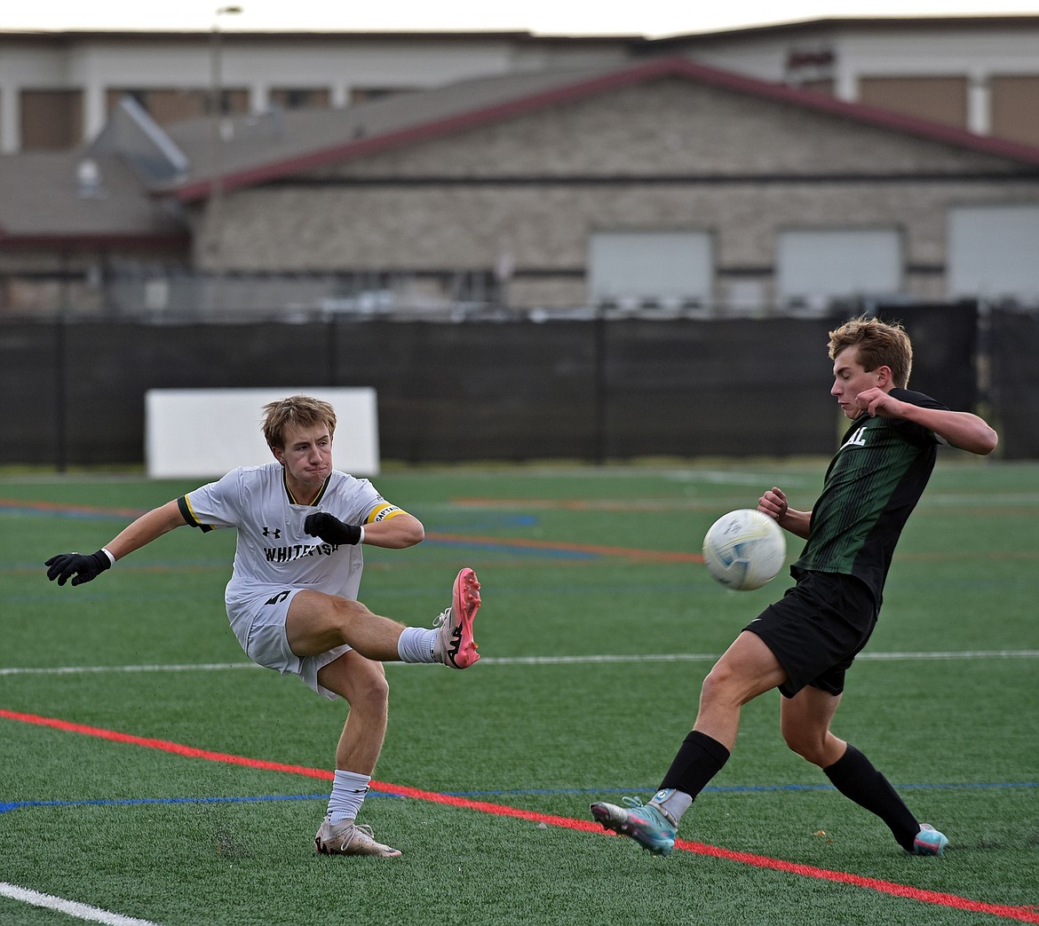 Whitefish senior Justis Arterbury sends a pass up field at the Montana Class A championship game on Saturday. (Julie Engler/Whitefish Pilot)