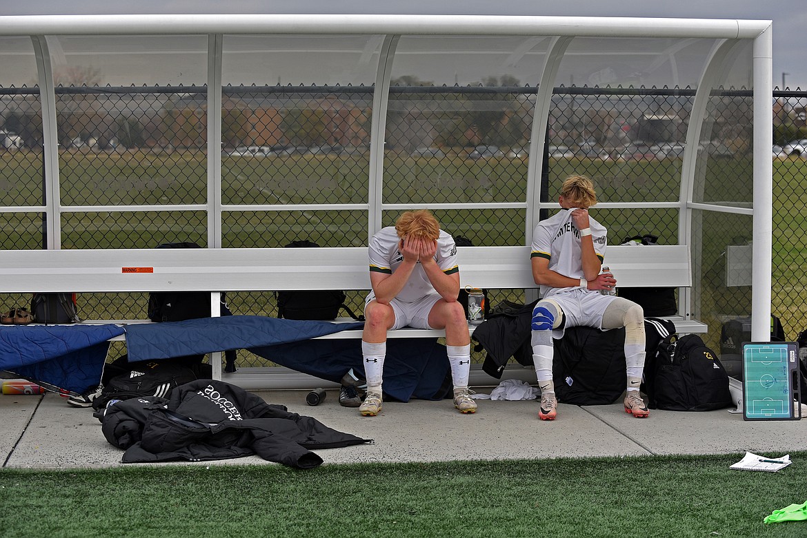 Bulldogs Rowan Perkins and Elijah Adams-Griffin take a moment after the Class A championship game on Saturday at Amend Park in Bilings. The Rams won 3-2 in overtime. (Julie Engler/Whitefish Pilot)