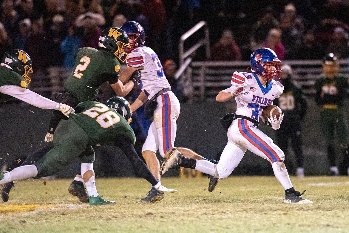 Tayden West gains some yardage for the Vikes against Whitefish Friday, Nov. 1. (Avery Howe/Bigfork Eagle)