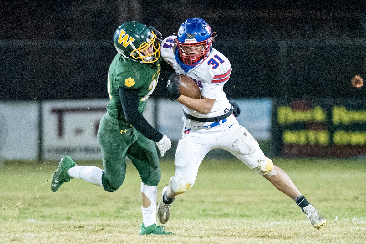 Viking Treker Hickey blows past a Whitefish defender Friday. (Avery Howe/Bigfork Eagle)