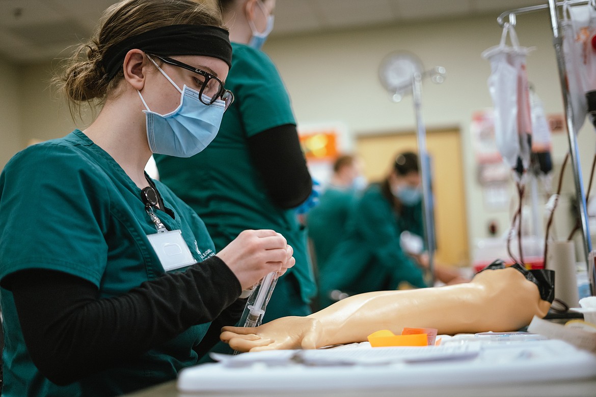 Former NIC student Janae Walcker practices in a nursing lab at the NIC Meyer Health and Sciences Building on Jan. 27, 2023.