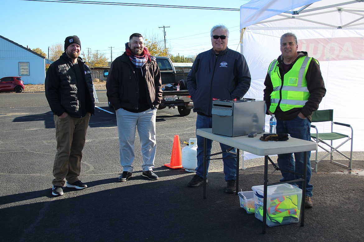 From left: Tanner Gilbert, Guillermo Mendez, Doug Barger and John Hunt directed traffic and picked up ballots in Othello on Election Day.