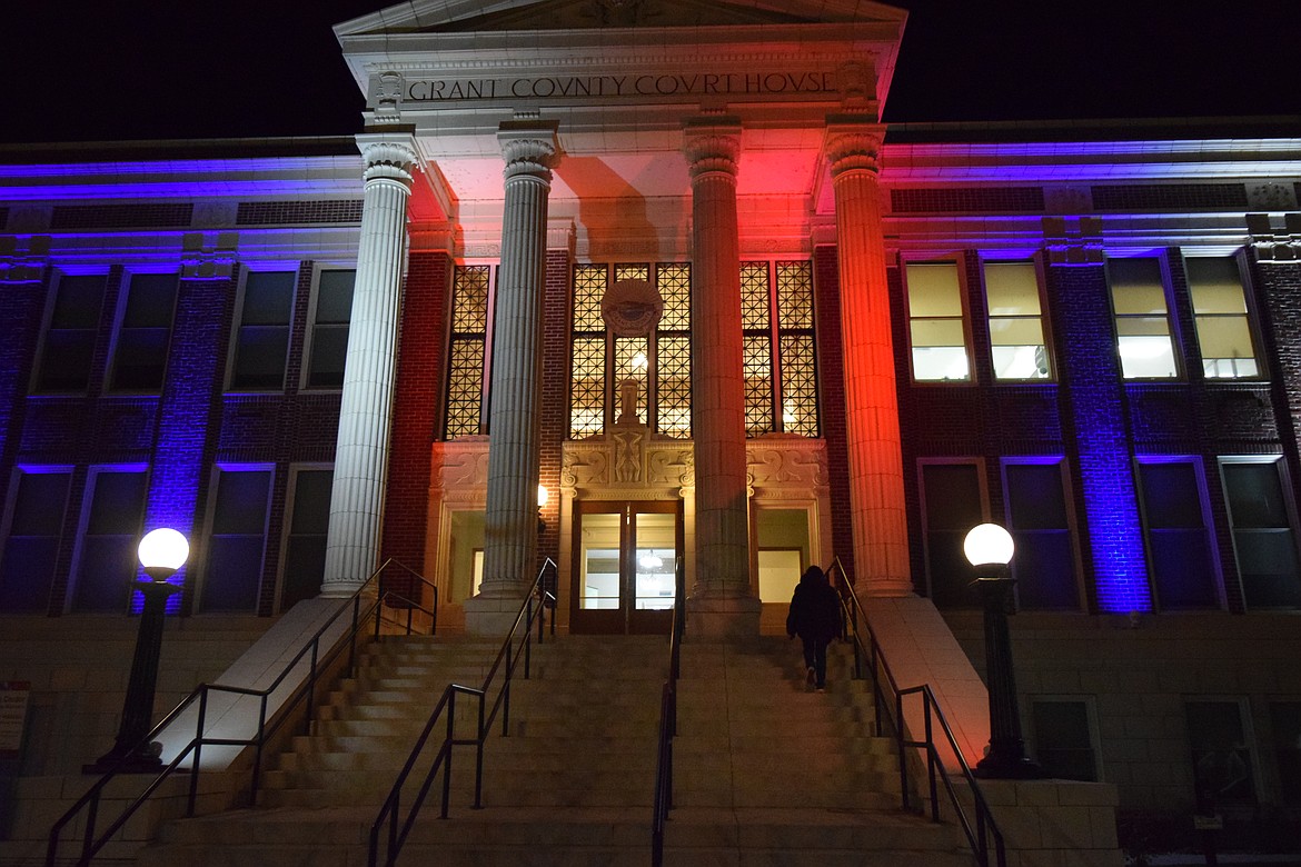 Elections Administrator Aleanah Lopez goes back into the Grant County Courthouse after locking the voting box in Ephrata to finalize the first results for Grant County elections.