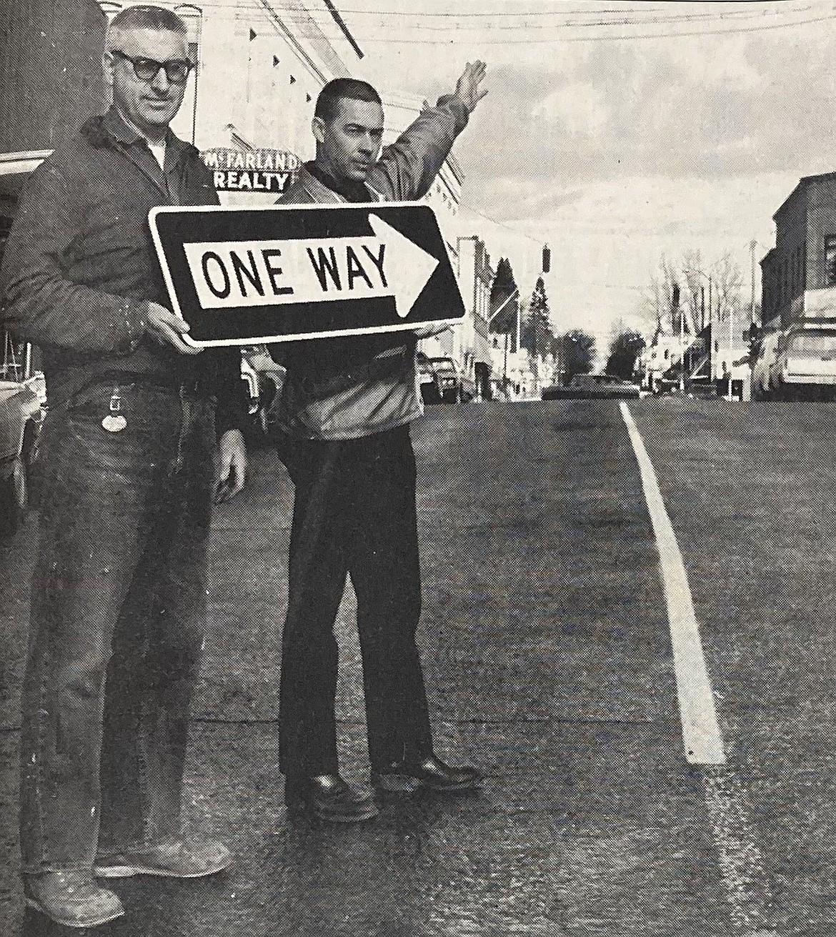 In 1969, street superintendent Reed Walker, right, and sign maker Othel Tucker promote Coeur d’Alene’s new one-way streets.