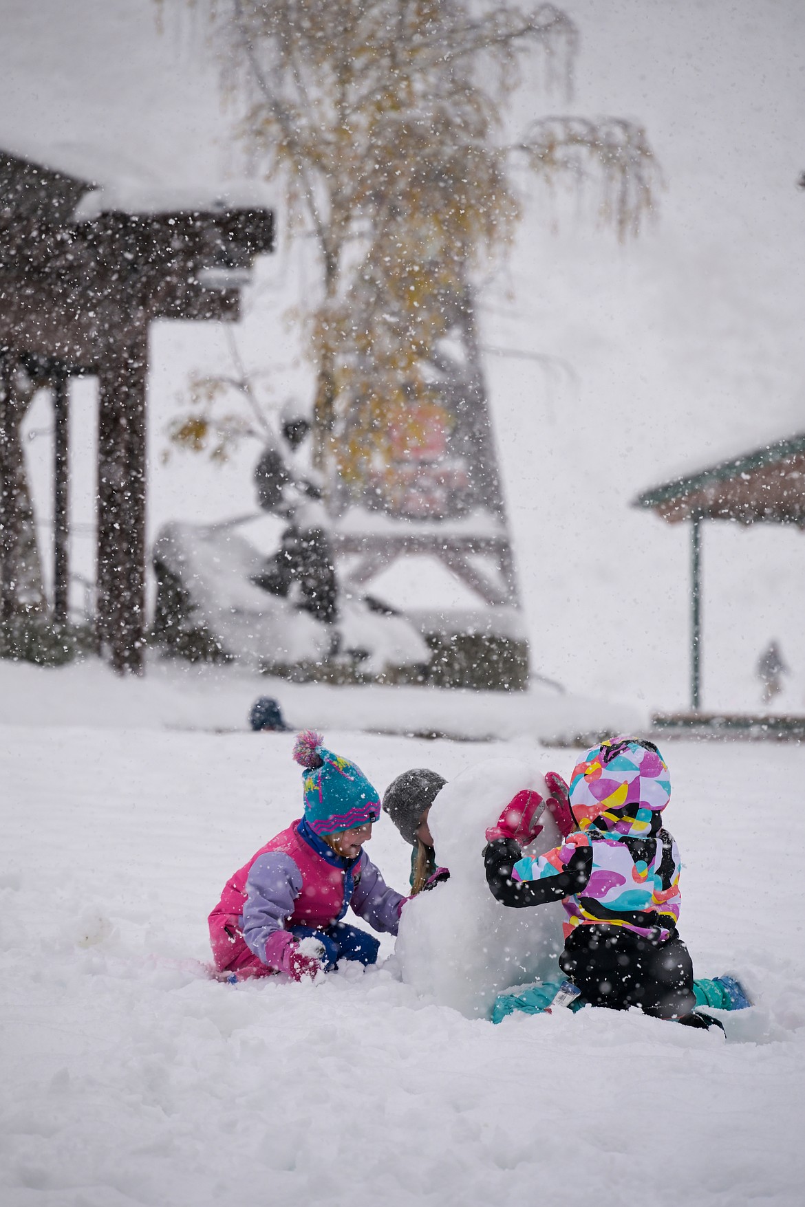 Area youth build a snowman late last week at Schweitzer as officials said the Sandpoint-based resort has roughly two feet of snow in recent weeks. The resort has set a Nov. 22 opening date.