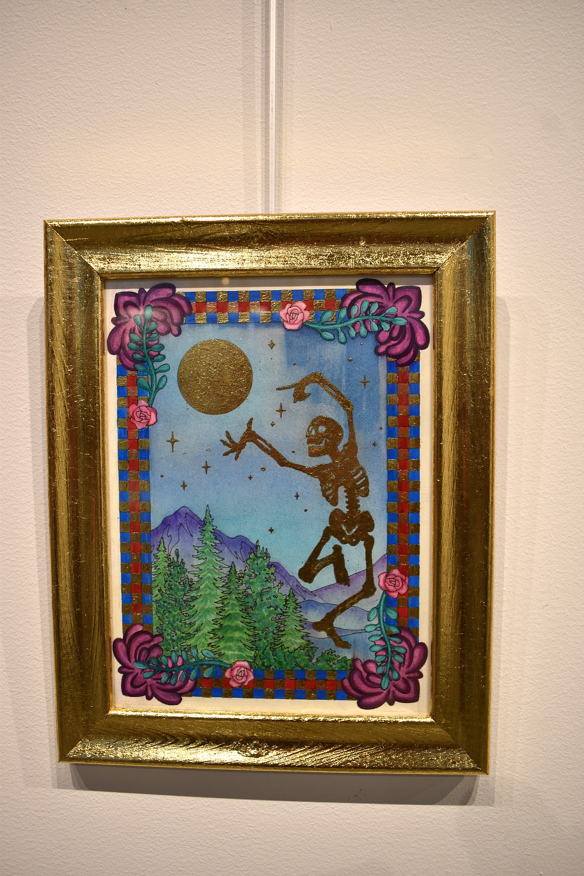 Museum employee and artist Bee Iverson created this gold leaf representation of the danse macabre, a medieval tradition that reminded people of their mortality and the fragility of life. It’s part of the Members Exhibition at the Moses Lake Museum & Art Center.