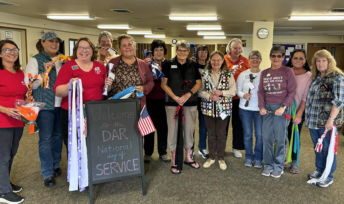 Members of the Daughters of the American Revolution Lt. George Farragut Chapter met Oct. 19 for a Day of Service to make fleece dog toys for Companions Animal Shelter as part of the nonprofit's Service to America initiative. From left: Lynn Talbot, Stephanie Keaty, Michelle Fansler, Patty Stills, Kathy Swanson, Donna Seil, RJ Banks, Renee Evans, Carlene Litz, Debbie Bryant, Sandy Wayman, Lori Norris, Janet Borek and Esther Miller.