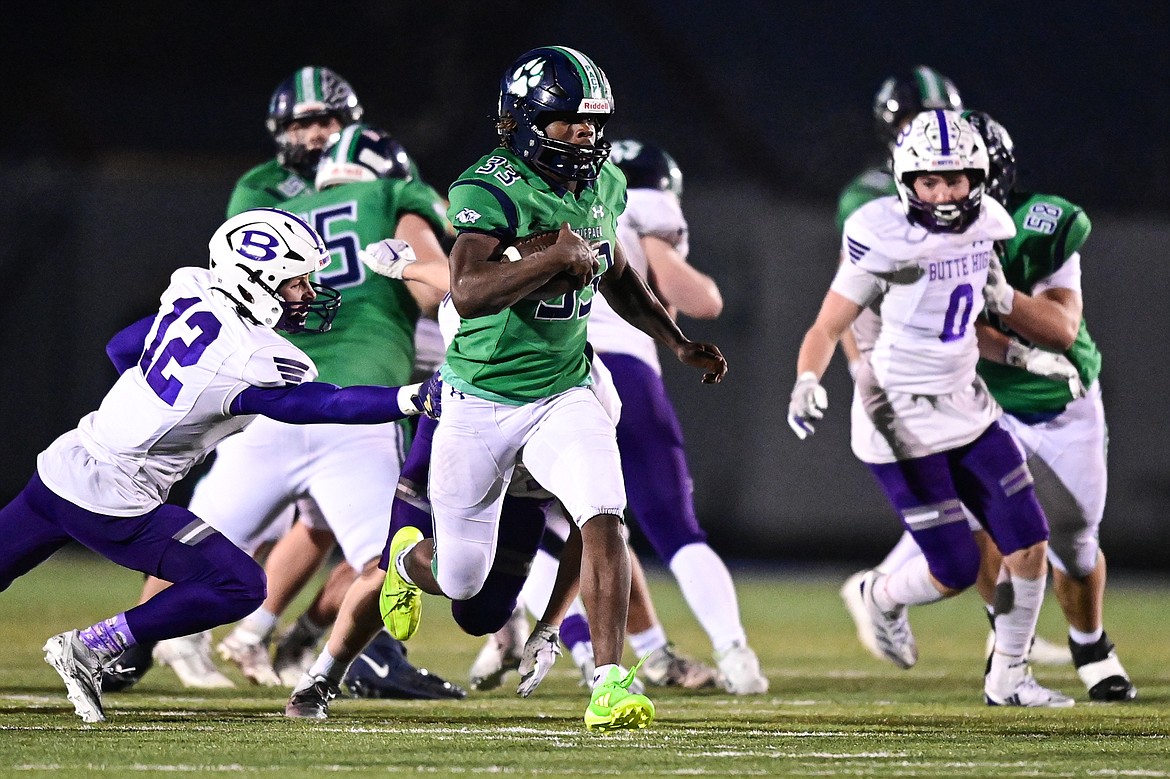 Glacier running back Kobe Dorcheus (33) heads to the end zone on a 46-yard touchdown run in the fourth quarter against Butte during a Class AA playoff game at Legends Stadium on Friday, Nov. 8. (Casey Kreider/Daily Inter Lake)