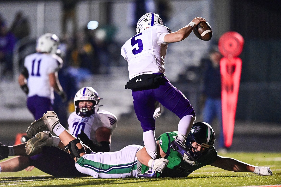 Glacier defensive lineman Maverick Diede (77) pressures Butte quarterback Colton Shea (5) on a pass in the second quarter during a Class AA playoff game at Legends Stadium on Friday, Nov. 8. (Casey Kreider/Daily Inter Lake)