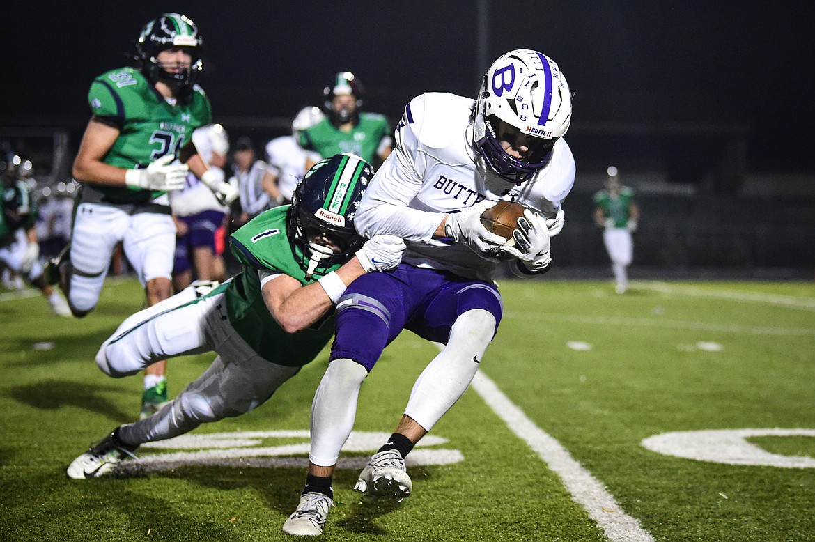 Glacier defensive back Bridger Smith (1) brings down Butte wide receiver Hudson Luedtke (8) on a reception in the second quarter during a Class AA playoff game at Legends Stadium on Friday, Nov. 8. (Casey Kreider/Daily Inter Lake)