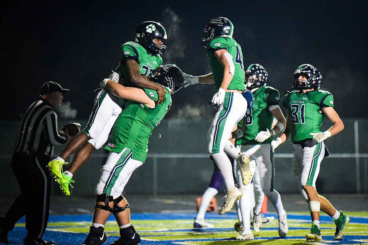 Glacier running back Kobe Dorcheus (33) celebrates with teammates after an 11-yard touchdown run in the third quarter against Butte during a Class AA playoff game at Legends Stadium on Friday, Nov. 8. (Casey Kreider/Daily Inter Lake)