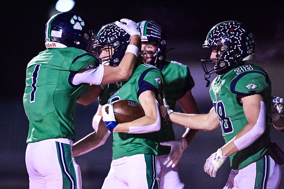 Glacier defensive back Easton Kauffman (19) celebrates with teammates after returning an interception 55 yards for a touchdown in the first quarter against Butte during a Class AA playoff game at Legends Stadium on Friday, Nov. 8. (Casey Kreider/Daily Inter Lake)