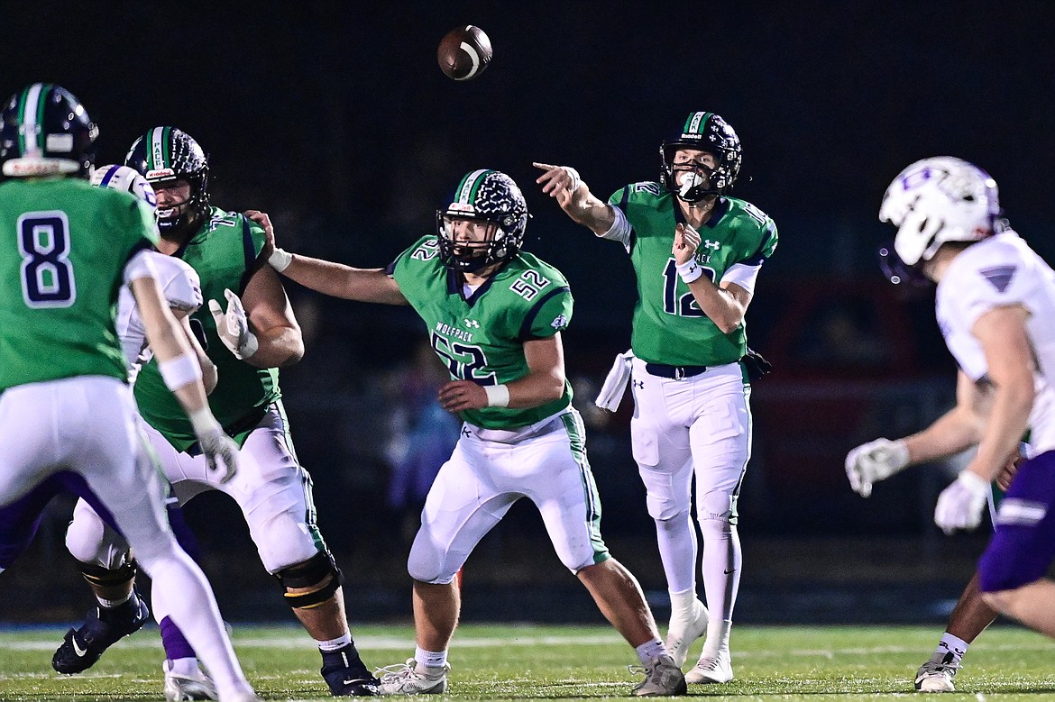 Glacier quarterback Jackson Presley (12) completes a pass to wide receiver Cooper Pelc (8) in the first quarter against Butte during a Class AA playoff game at Legends Stadium on Friday, Nov. 8. (Casey Kreider/Daily Inter Lake)