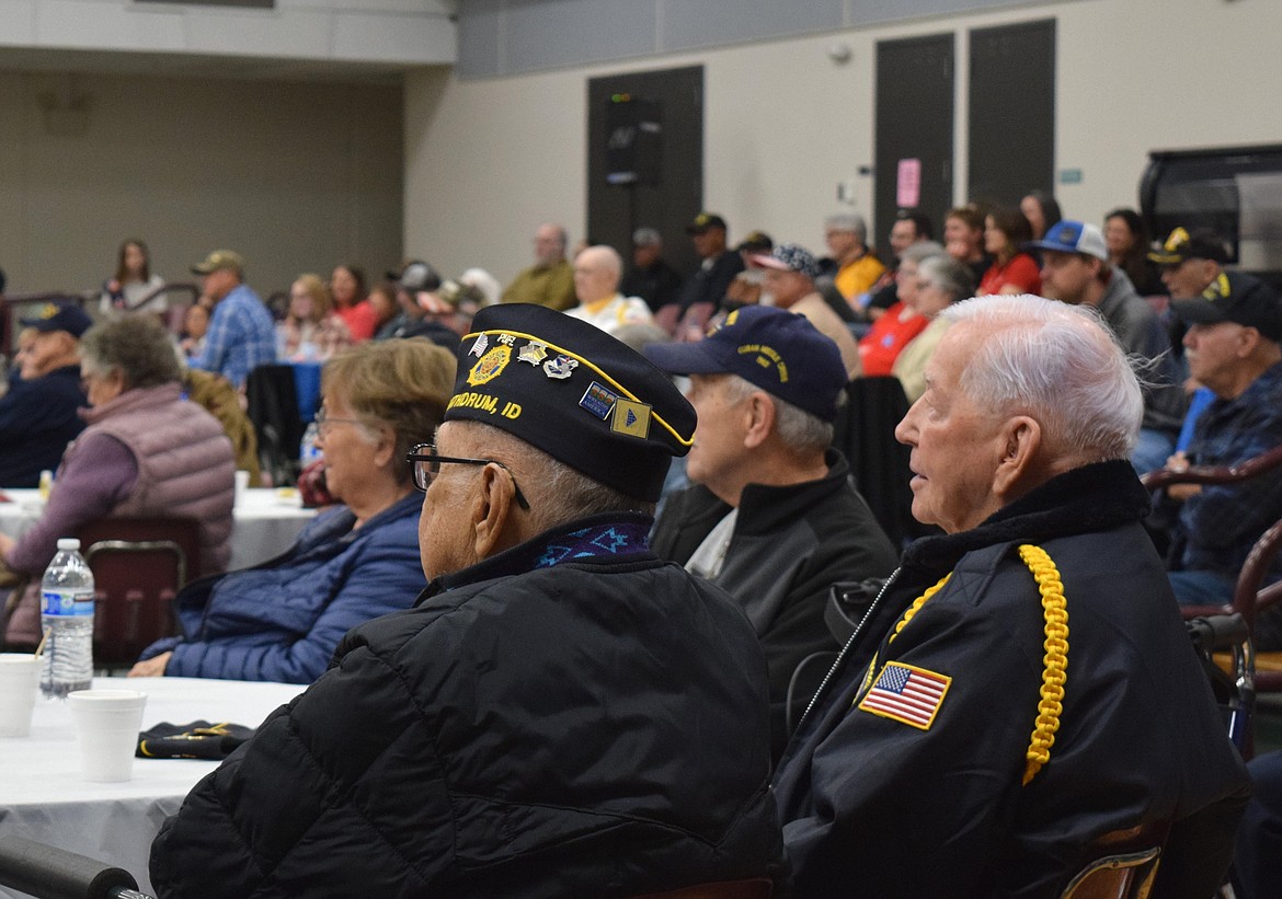 U.S. Air Force Veteran Harold Markiewicz, left, and Korean War Navy veteran Hal Donahue, right, listen to guest speakers during Saturday’s Veterans Recognition Ceremony in Rathdrum.