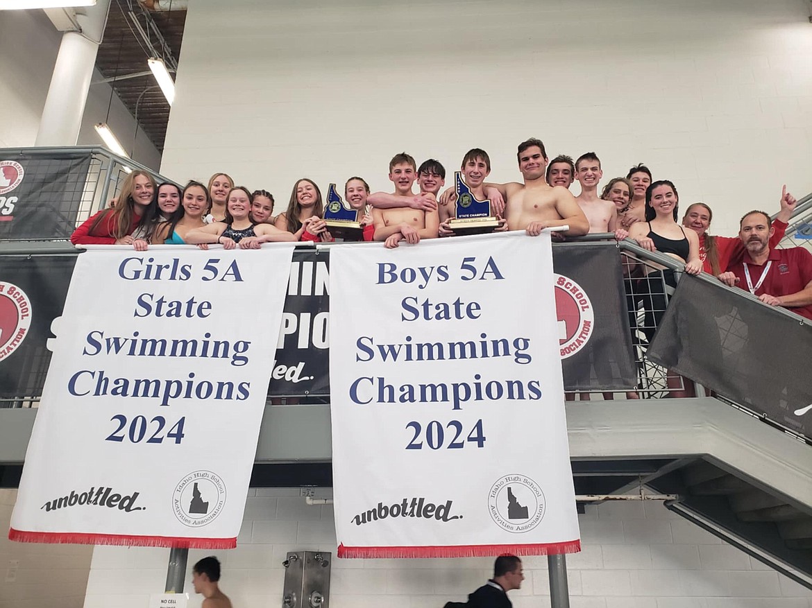 Courtesy photo
The Sandpoint High boys and girls swim teams captured 5A state titles on Saturday at the West Ada YMCA in Boise. From left are are assistant coach Mikayla Schoening, Rachel Aylward, Reina Montecchi, Ava de Leeuw, Bria Rocke, Halle Wyman, Summer Loutzenhiser, Mia Driggs, McCoy Jensen, Kale Wright, Kai Leavitt, Max Zuberbuhler, Lou Foust, Phin Bricher, Bodi Demmons, Max Brown, Ryleigh Bamer, assistant coach Bri Staglund, and head coach Greg Jackson.