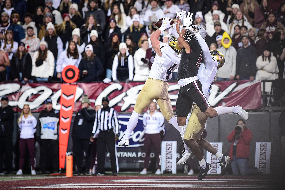 UC Davis defensive back Rex Connors (4) intercepts a pass intended for Grizzlies wide receiver Keelan White (6) in the second quarter at Washington-Grizzly Stadium on Saturday, Nov. 9. (Casey Kreider/Daily Inter Lake)