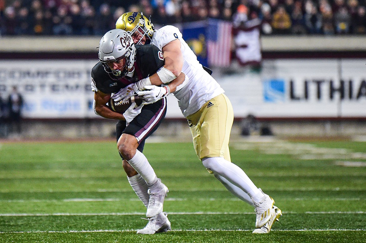 Grizzlies wide receiver Keelan White (6) is brought down by UC Davis linebacker David Meyer after a reception in the second quarter against UC Davis at Washington-Grizzly Stadium on Saturday, Nov. 9. (Casey Kreider/Daily Inter Lake)