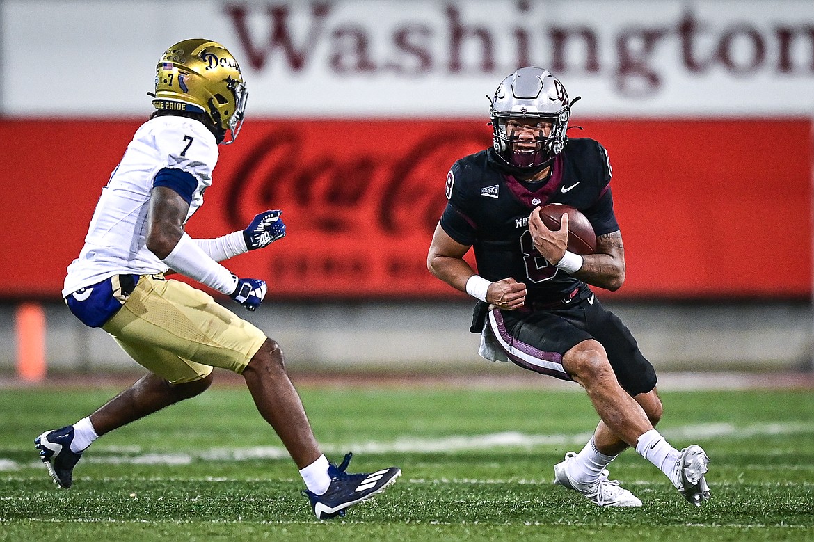 Grizzlies quarterback Keali'i Ah Yat (8) picks up yardage on a run in the third quarter against UC Davis at Washington-Grizzly Stadium on Saturday, Nov. 9. (Casey Kreider/Daily Inter Lake)