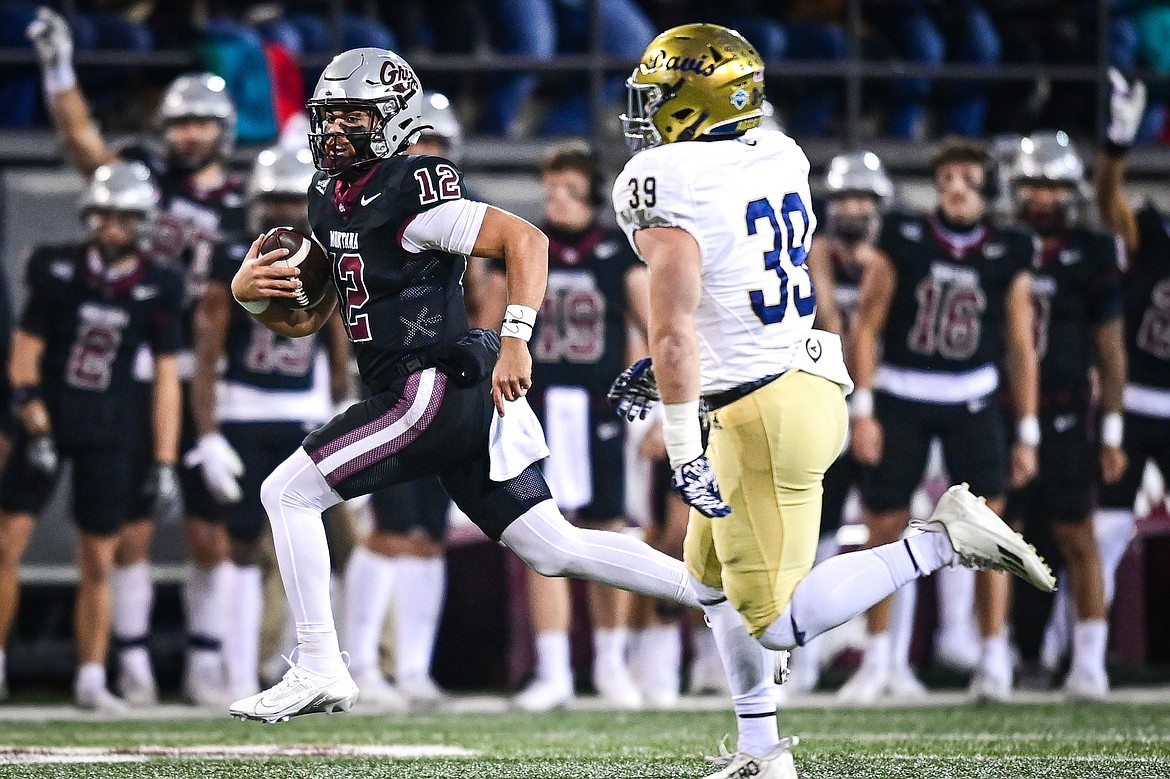 Grizzlies quarterback Logan Fife scrambles for 13-yards in the first quarter against UC Davis at Washington-Grizzly Stadium on Saturday, Nov. 9. (Casey Kreider/Daily Inter Lake)