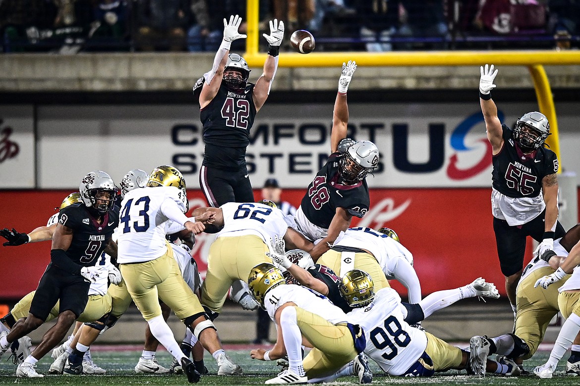 Grizzlies defenders Riley Wilson (42), Hayden Harris (48) and Andres Lehrmann (55) try to block a 40-yard field goal by UC Davis kicker Hunter Ridley (43) in the fourth quarter at Washington-Grizzly Stadium on Saturday, Nov. 9. (Casey Kreider/Daily Inter Lake)