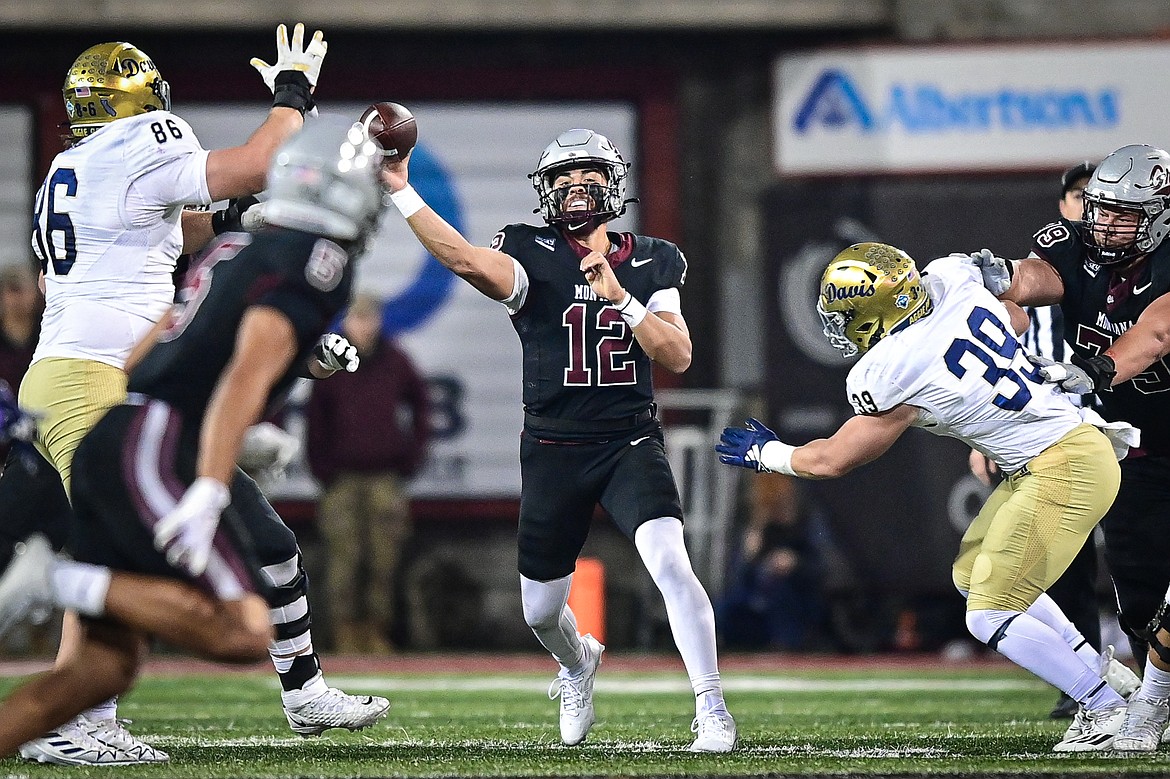 Grizzlies quarterback Logan Fife (12) throws a pass to wide receiver Junior Bergen (5) in the second quarter against UC Davis at Washington-Grizzly Stadium on Saturday, Nov. 9. (Casey Kreider/Daily Inter Lake)