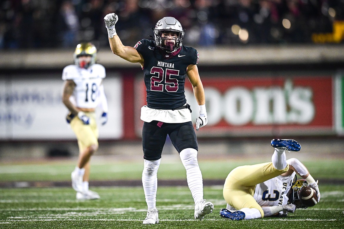 Grizzlies safety Jaxon Lee (25) celebrates after tackling UC Davis running back Lan Larison (3) in the first quarter at Washignton-Grizzly Stadium on Saturday, Nov. 9. (Casey Kreider/Daily Inter Lake)