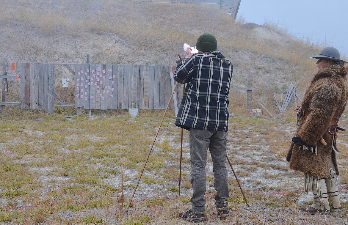 Participant fires at cards during the poker round of last Saturday's Turkey Shoot at Fort Connah. Organizers say the inaugural event attracted about 20 participants and several onlookers to the historic trading post. (Kristi Niemeyer/Leader)