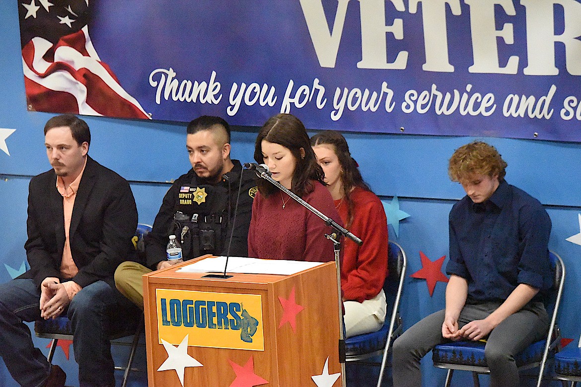 Libby High School's Emmah Barnes reads an essay Monday, Nov. 11, 2024, during a Veterans Day Assembly. (Scott Shindledecker/The Western News)