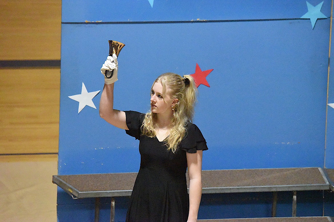 Libby High School student Sidnie Thompson rings a bell Monday, Nov. 11, 2024, during a Veterans Day Assembly at Libby High School. (Scott Shindledecker/The Western News)
