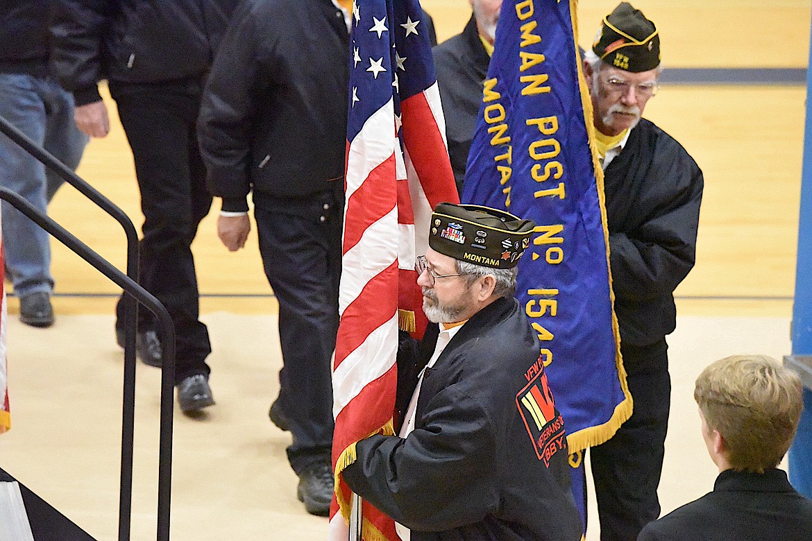 Members of the Veterans of Foreign Wars Harper Erdman Post 1548 present the colors Monday, Nov. 11, 2024, during a Veterans Day Assembly at Libby High School. (Scott Shindledecker/The Western News)