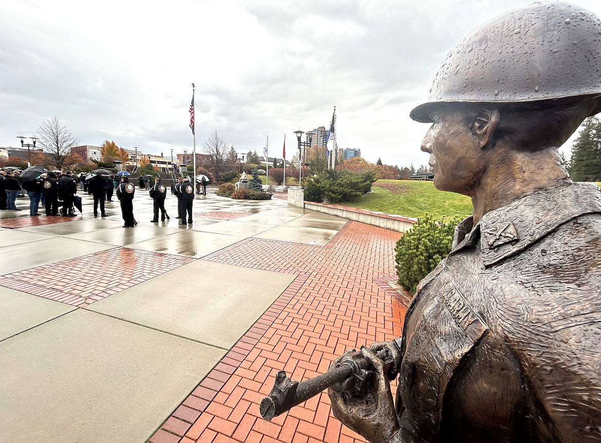 A statue honoring the late Bud Ford of Coeur d'Alene for his military career stands at Veterans Memorial Plaza on Veterans Day on Monday.